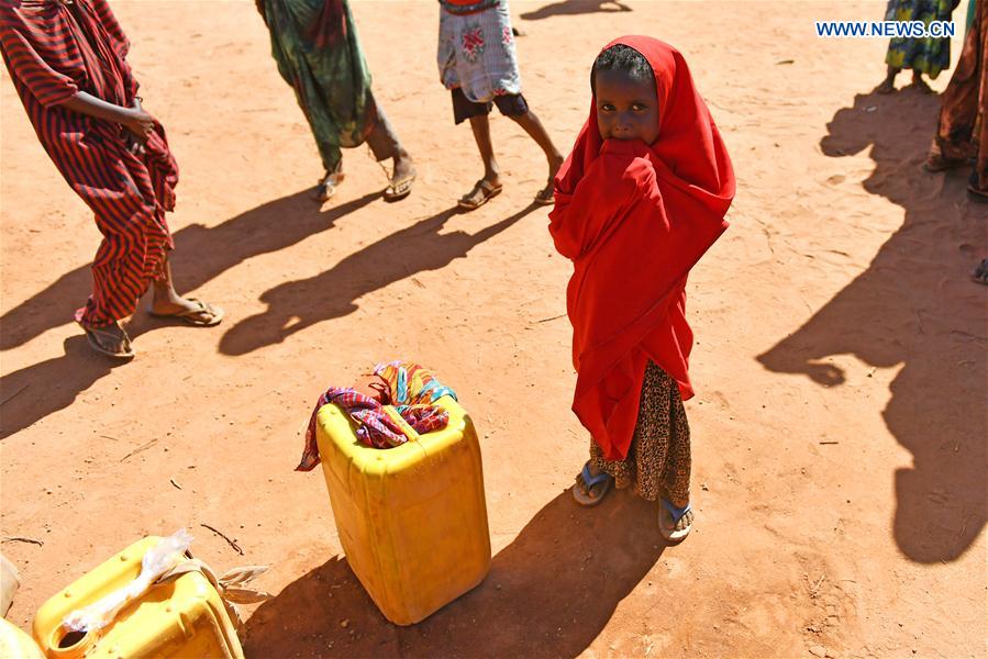 Photo taken on March 19, 2017 shows a little girl waiting to get water at an Internal Displaced Person (IDP) camp in Doolow, a border town with Ethiopia, Somalia. Photo taken on March 19, 2017 shows a little girl waiting to get water at an Internal Displaced Person (IDP) camp in Doolow, a border town with Ethiopia, Somalia.