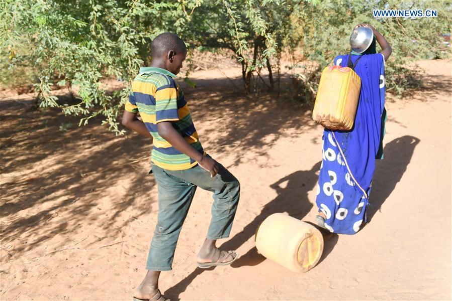A boy returns with water near Doolow, a border town with Ethiopia, Somalia, on March 20, 2017. A boy returns with water near Doolow, a border town with Ethiopia, Somalia, on March 20, 2017.