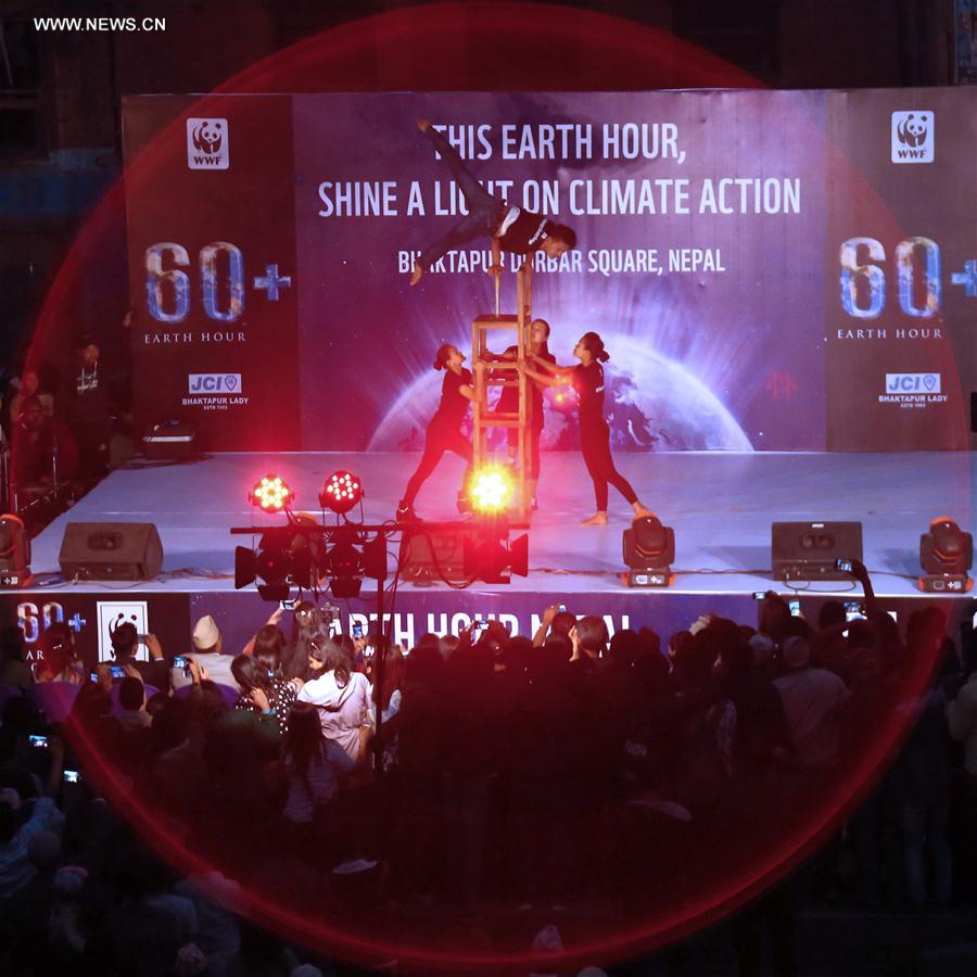 Artists perform during a celebration of the Earth Hour in Bhaktapur, Nepal, March 25, 2017.