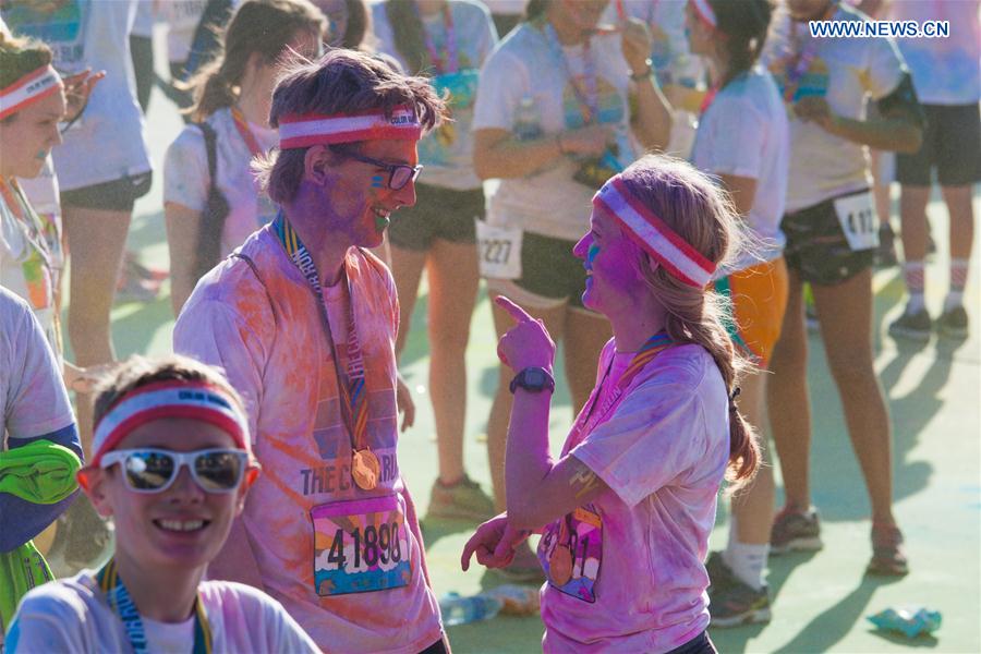 People take part in the 'Color Run' in Dallas, Texas, the United States, March 25, 2017. 