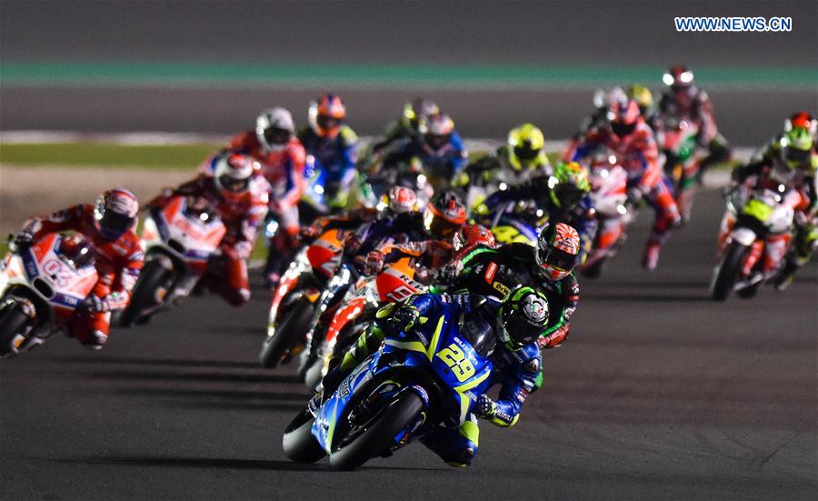 Riders compete during the final race of 2017 FIM MotoGP Grand Prix of Qatar at the Losail International Circuit in Doha, capital of Qatar, on March 26, 2017. 