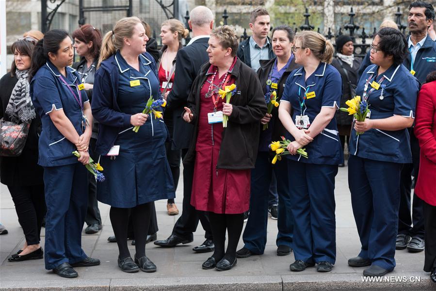 Members of muslim community attend an event on Westminster Bridge to commemorate the victims of last week's terror attacks in London, Britain on March 29, 2017.