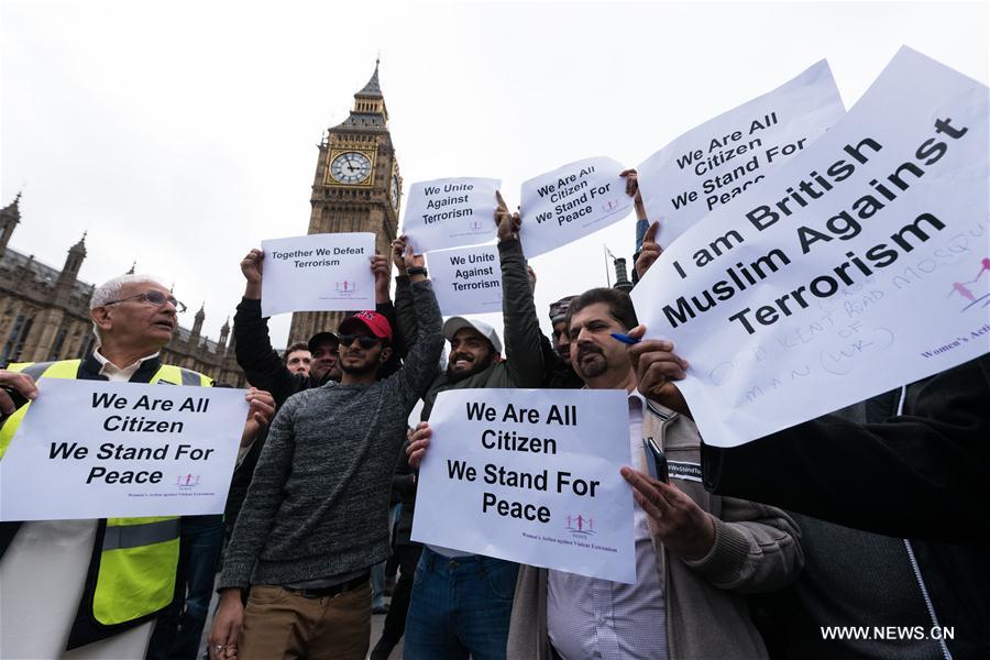 Members of muslim community attend an event on Westminster Bridge to commemorate the victims of last week's terror attacks in London, Britain on March 29, 2017.