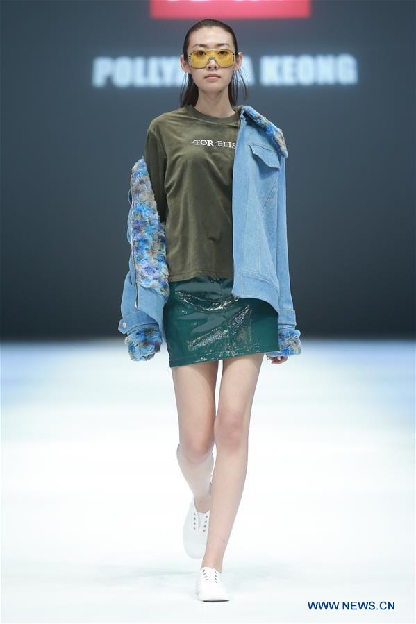 A model presents a creation designed by Jiang Yueyin during China Fashion Week in Beijing, capital of China, March 29, 2017. (Xinhua/Chen Jianli) 