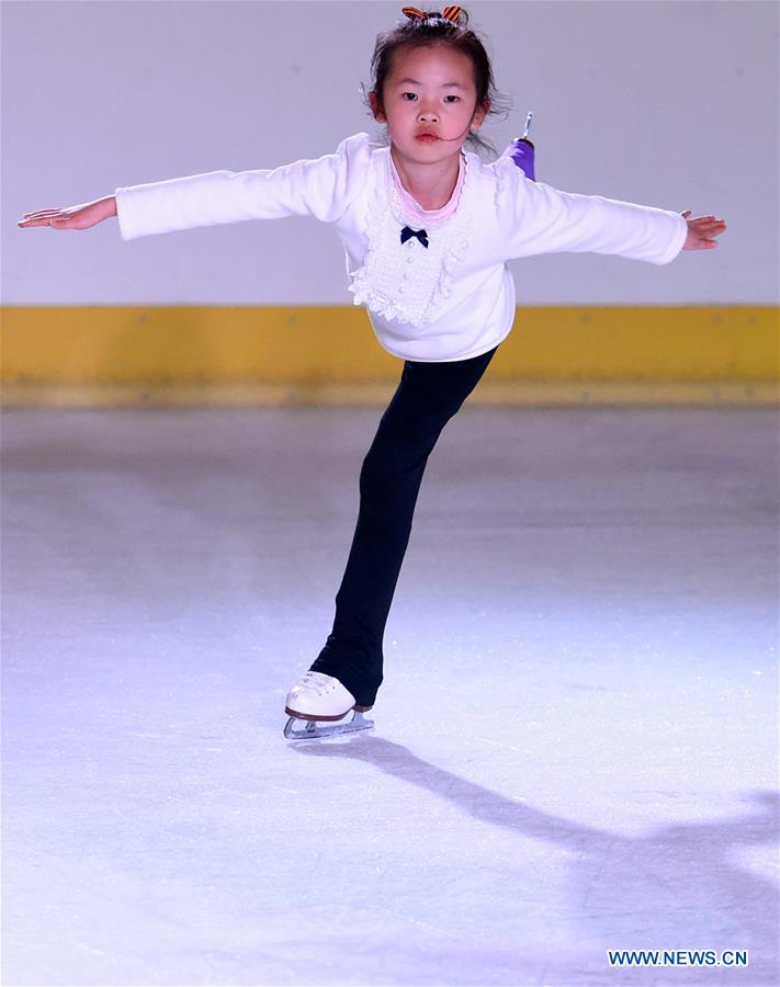 A girl practices figure skating in the Century Star Rink in Kunming, capital of southwest China's Yunnan province, March 16, 2017.