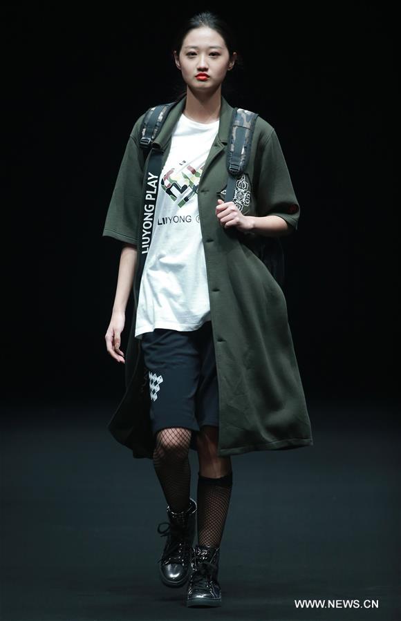 A model presents a creation by Liu Yong during China Fashion Week in Beijing, capital of China, March 30, 2017.