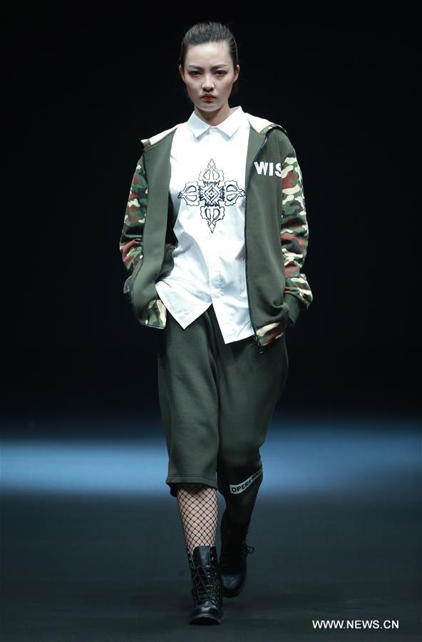 A model presents a creation by Liu Yong during China Fashion Week in Beijing, capital of China, March 30, 2017. 