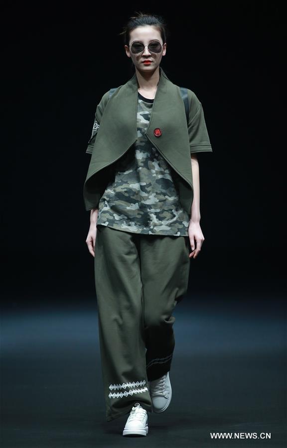 A model presents a creation by Liu Yong during China Fashion Week in Beijing, capital of China, March 30, 2017. 