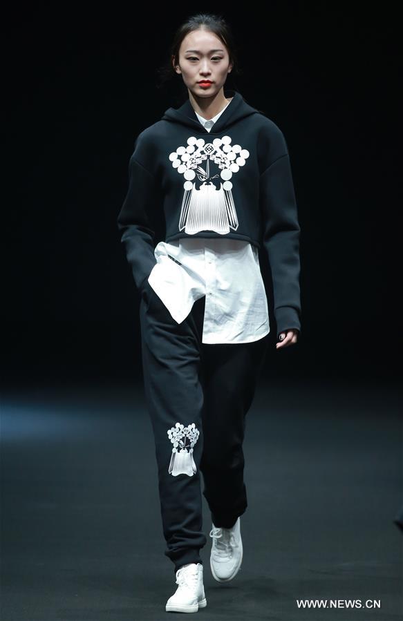 A model presents a creation by Liu Yong during China Fashion Week in Beijing, capital of China, March 30, 2017. 