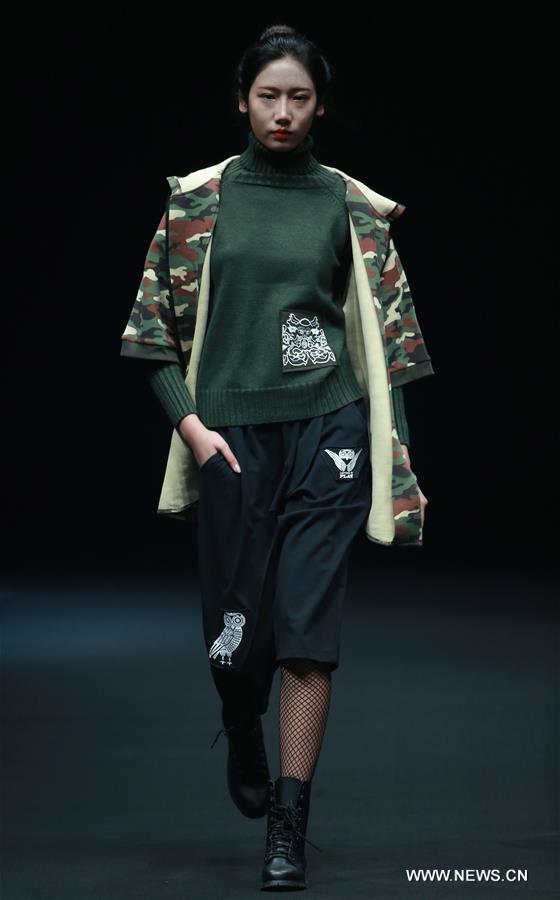 A model presents a creation by Liu Yong during China Fashion Week in Beijing, capital of China, March 30, 2017.
