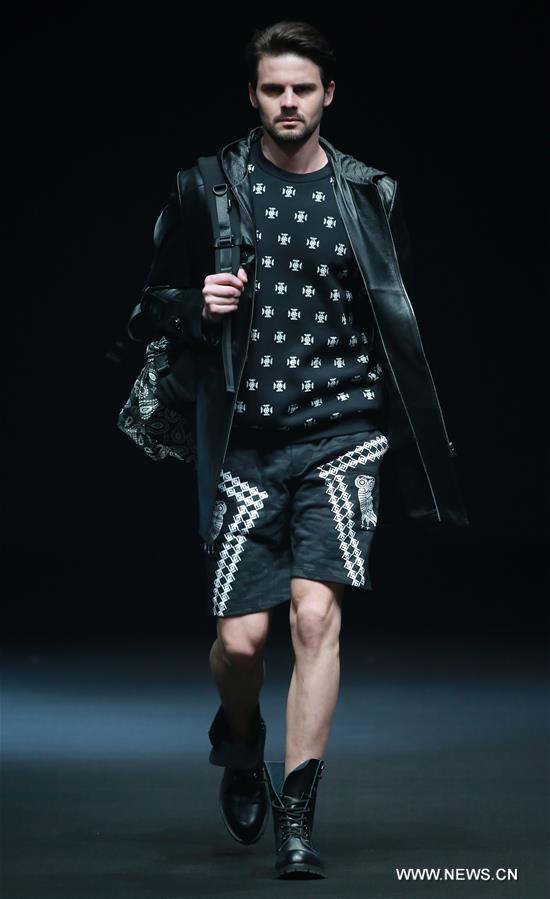A model presents a creation by Liu Yong during China Fashion Week in Beijing, capital of China, March 30, 2017.