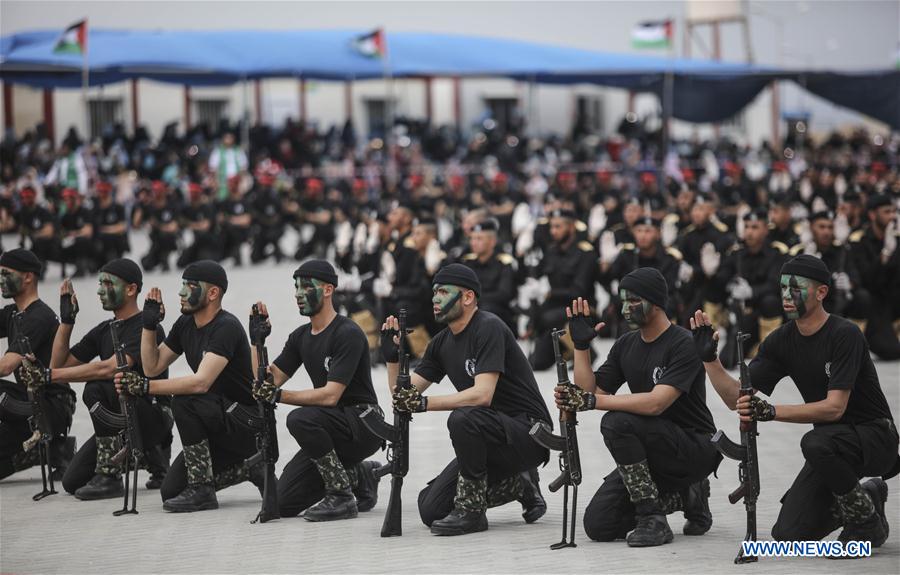 Members of the Palestinian Hamas security forces show their skills as they take part in a military graduation ceremony in Gaza City on March 30, 2017. (Xinhua/Wissam Nassar) 