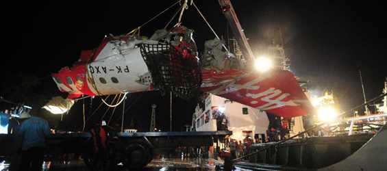 Tail part of AirAsia flight QZ8501 transferred in Indonesia