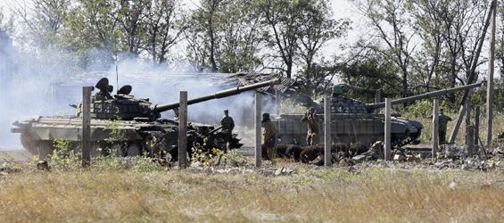 Ukraine withdraws heavy weapons from front line after Paris talks