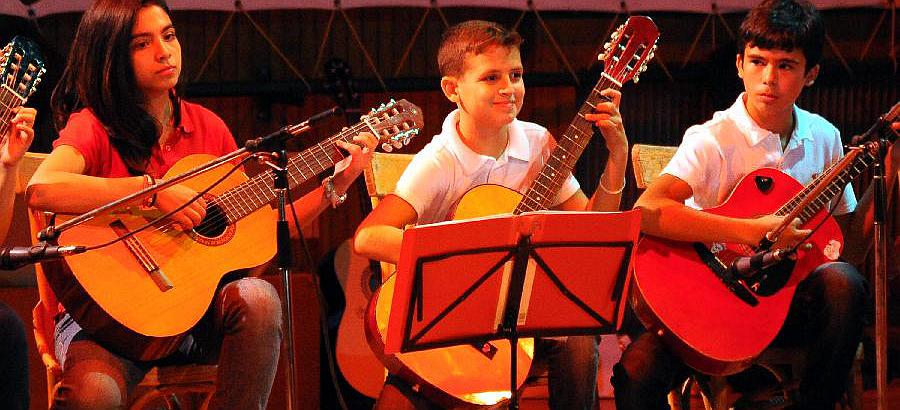 Syrian children play guitar in Damascus