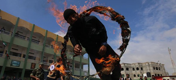 Palestinian students demonstrate military skills at graduation ceremony