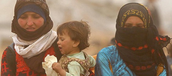 Refugees wait to cross Jordan-Syria border