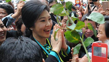 Ex-Thai premier Yingluck appears in court over rice subsidy scheme