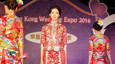 Models present wedding dresses at HK Wedding Expo