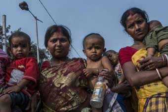 Indian mothers participate in protest demanding maternity benefit