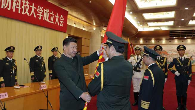 President Xi confers army flag to three newly-reconstructed military institutions