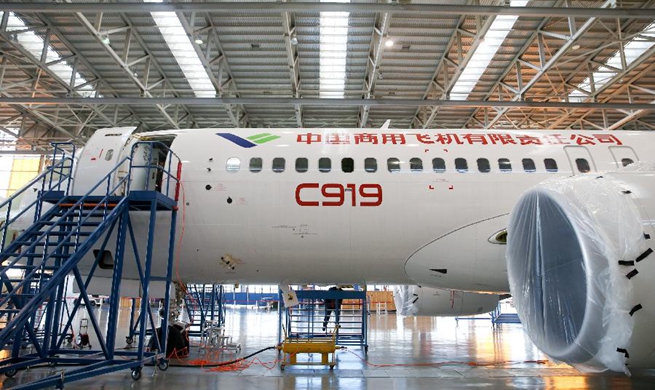 Staff members work on China's large passenger aircraft C919 in Shanghai