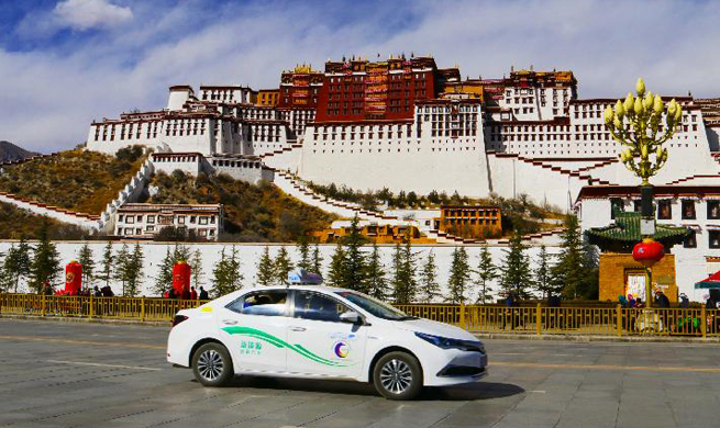 Lhasa puts 128 new gas-electric hybrid buses on road