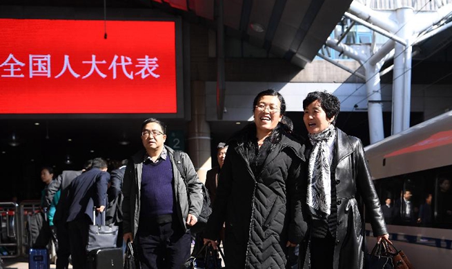Deputies to 13th NPC arrive in Beijing
