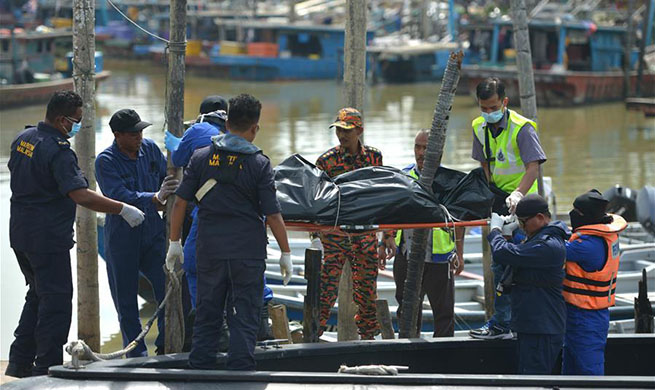 Rescuers recover one body from inside capsized dredger off Malaysia