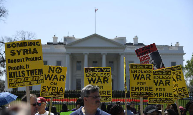 People protest against U.S. strike on Syria in Washington D.C.
