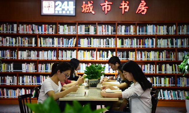 People read books at 24-hour self-service library in China's Chongqing