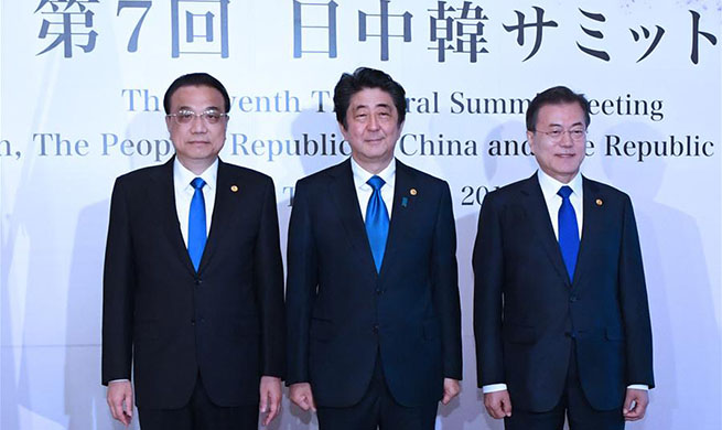 Xinhua Headlines: China, Japan, South Korea say resounding "no" to protectionism