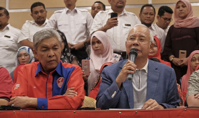 Former Malaysian PM Najib resigns as party chief, barred from leaving country