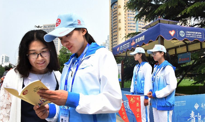 Volunteers offer services for upcoming SCO summit in Qingdao