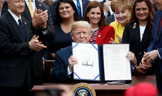 Trump speaks at bill signing ceremony for "VA Mission Act of 2018" in White House