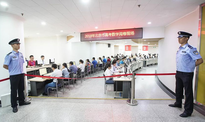 Teachers score examination papers of national college entrance examination in Beijing