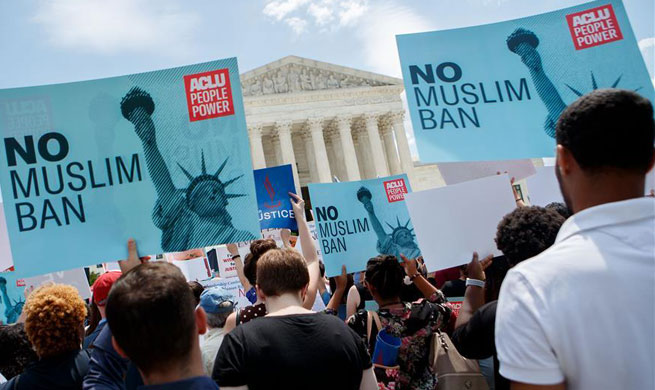 People protest against Supreme Court's ruling regarding Trump's travel ban