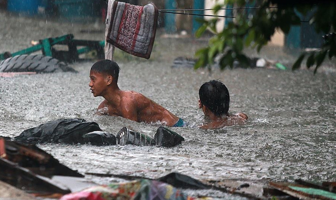Tropical storm brings flood water in Quezon City, the Philippines