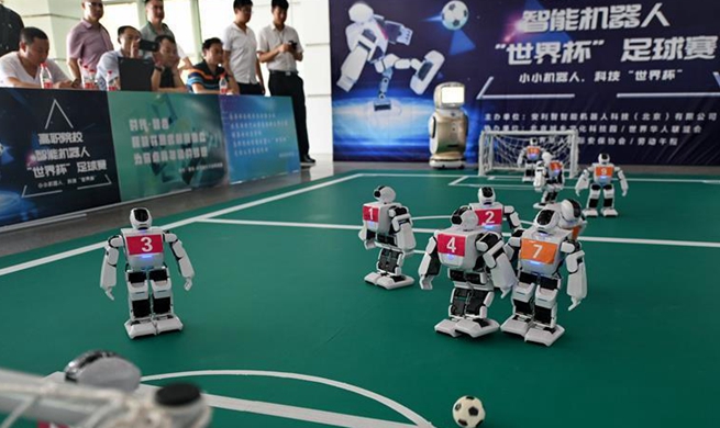Students take part in robot football match in Beijing