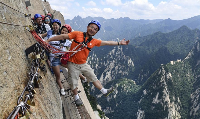 Huashan Mountain's Chang Kong Plank Road attracts explorers in NW China's Shaanxi