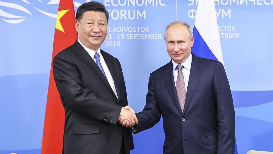 Xi, Putin vow to promote ties regardless of global changes
