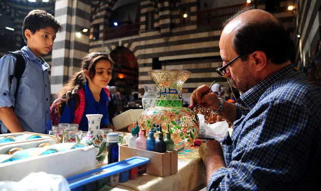 People visit traditional handicrafts exhibition in Damascus, Syria