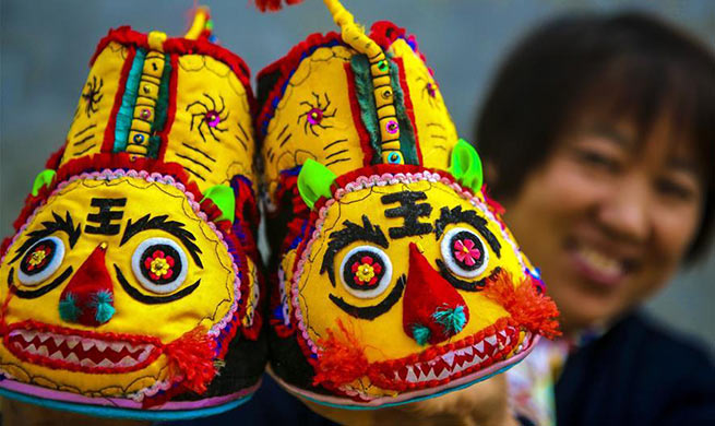 Tiger-head shoes making helps rural women increase income in Wugong, China's Hebei