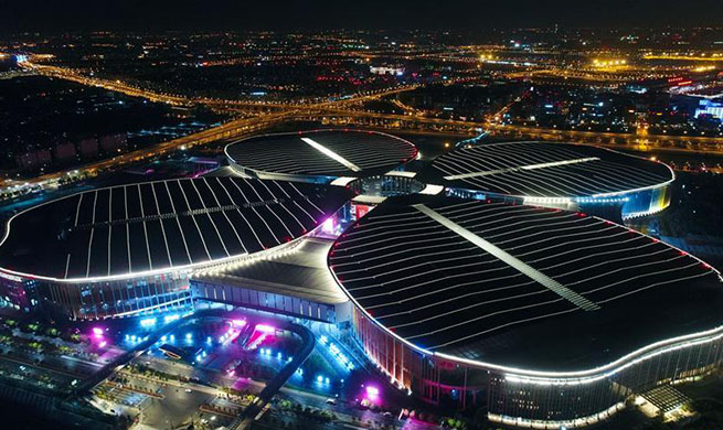 Night view of National Exhibition and Convention Center in Shanghai