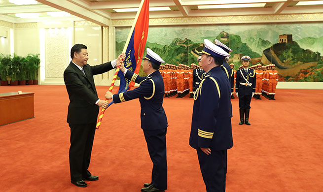 Xi confers flag to new national fire and rescue team