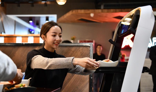 Robots serve food in smart restaurant in Tianjin