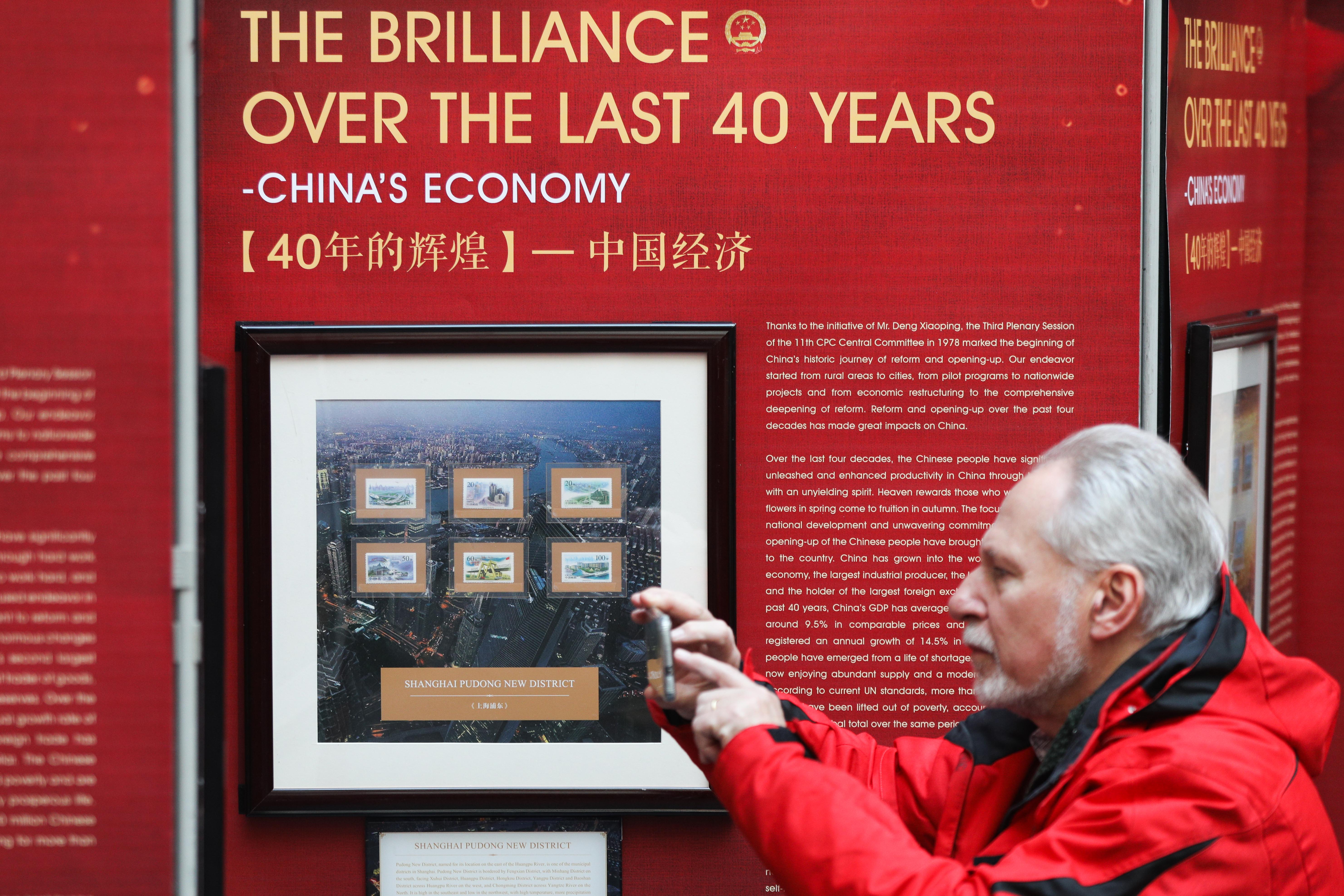 Stamp exhibition in Belgium marks 40th anniversary of China's reform, opening up