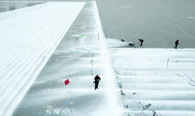 Workers collect ice from Songhua River for upcoming snow festival