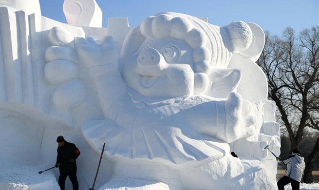 In pics: snow sculpture with "happy pigs" theme in Harbin, NE China