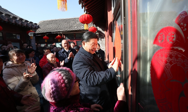Xi visits cadres, residents in Beijing ahead of Spring Festival